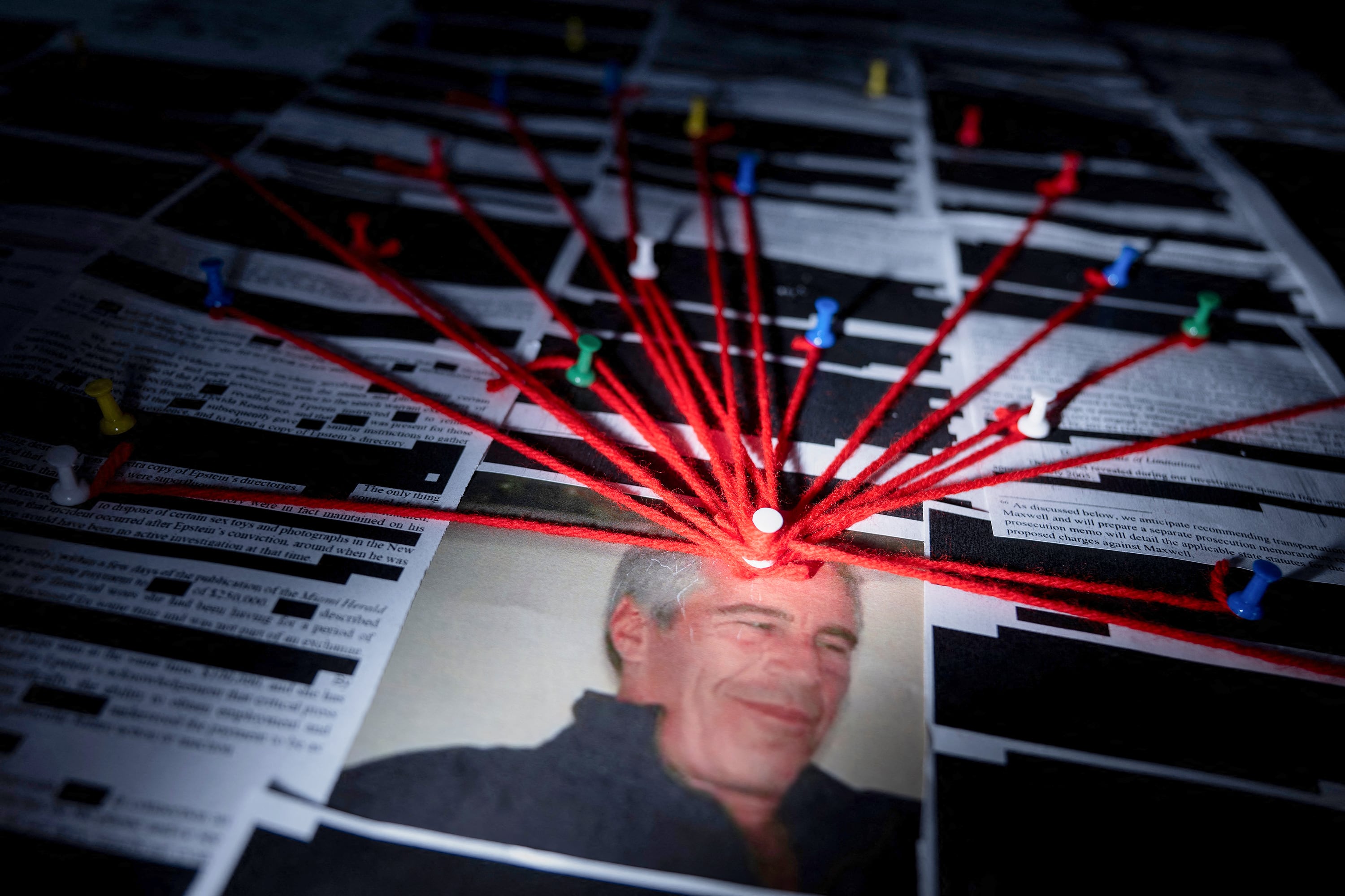 This photo illustration shows redacted documents from the Epstein Library files released by the US Department of Justice in Washington, DC, on February 18, 2026.