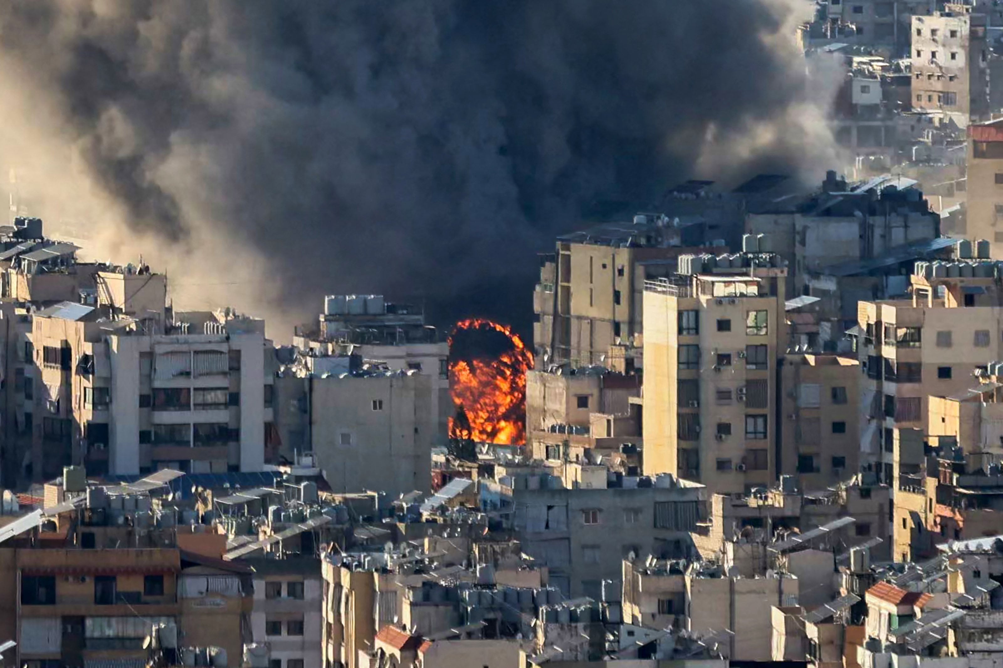 Smoke plumes billow following Israeli bombardment on Beirut's southern suburbs on March 2, 2026. The war launched by the United States and Israel against Iran spread across the Middle East on March 2 with Lebanon's Hezbollah entering the fray and a British air base in Cyprus targeted. (Photo by IBRAHIM AMRO / AFP)