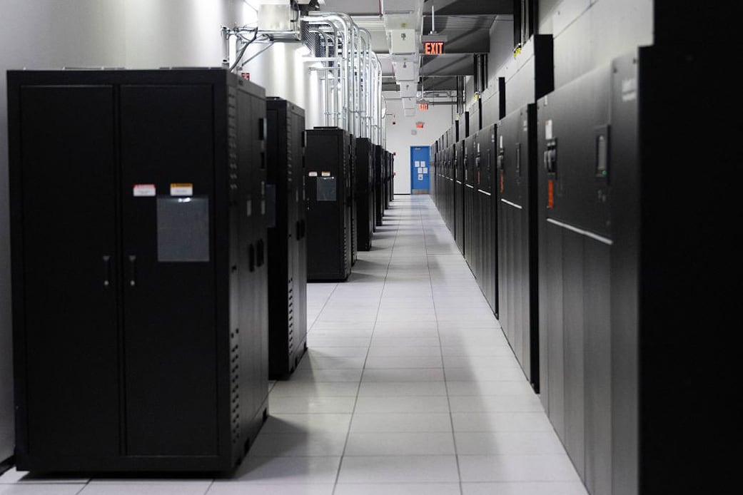 Power banks on the left, and active servers are seen at a Digital Realty data center in Ashburn, Virginia on November 12, 2025. (Photo by ANDREW CABALLERO-REYNOLDS / AFP)
