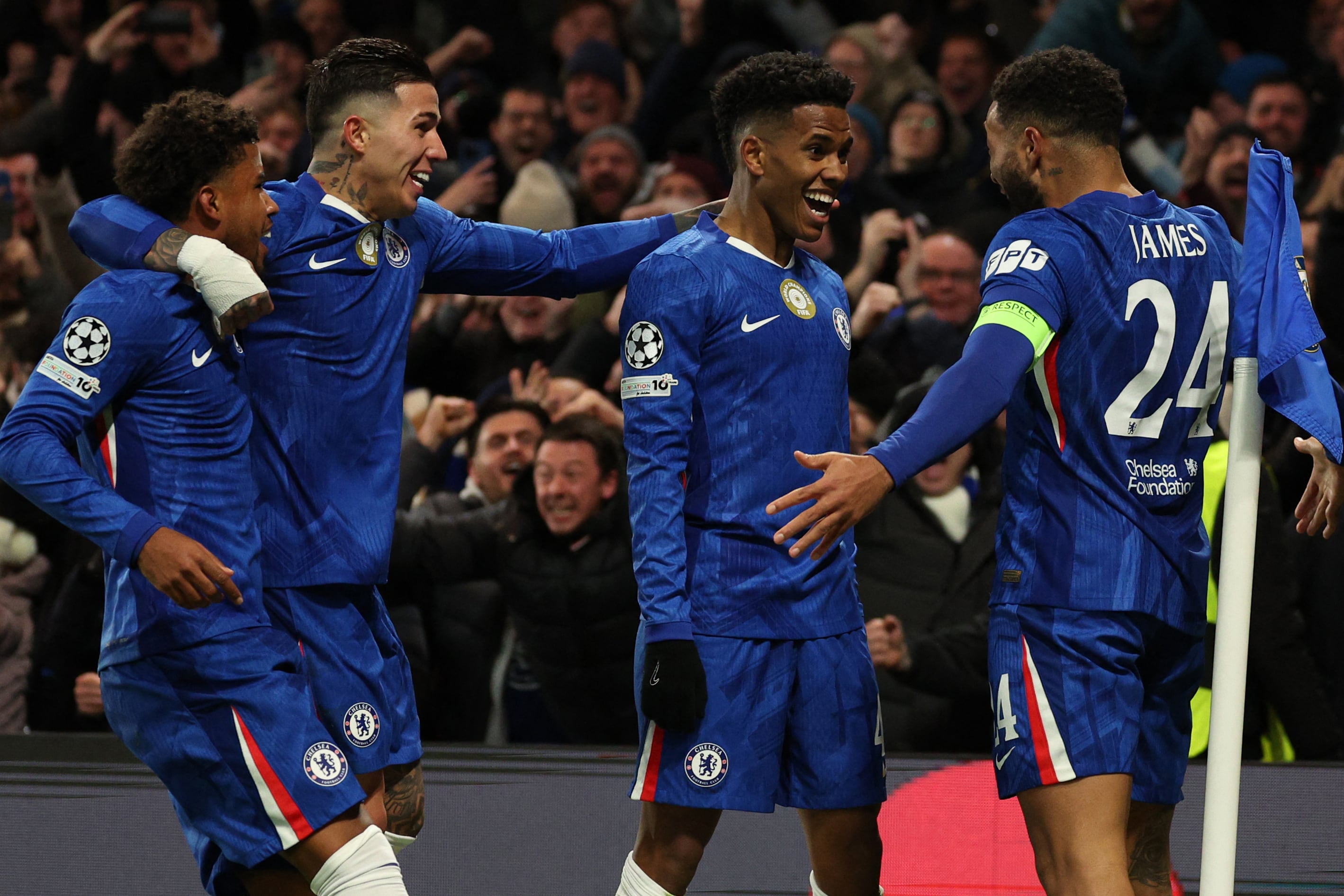 Chelsea's Brazilian midfielder #41 Estevao (C) celebrates with teammates after scoring their second goal during the UEFA Champions League league-phase football match between Chelsea and Barcelona at Stamford Bridge in London on November 25, 2025. (Photo by Adrian Dennis / AFP)