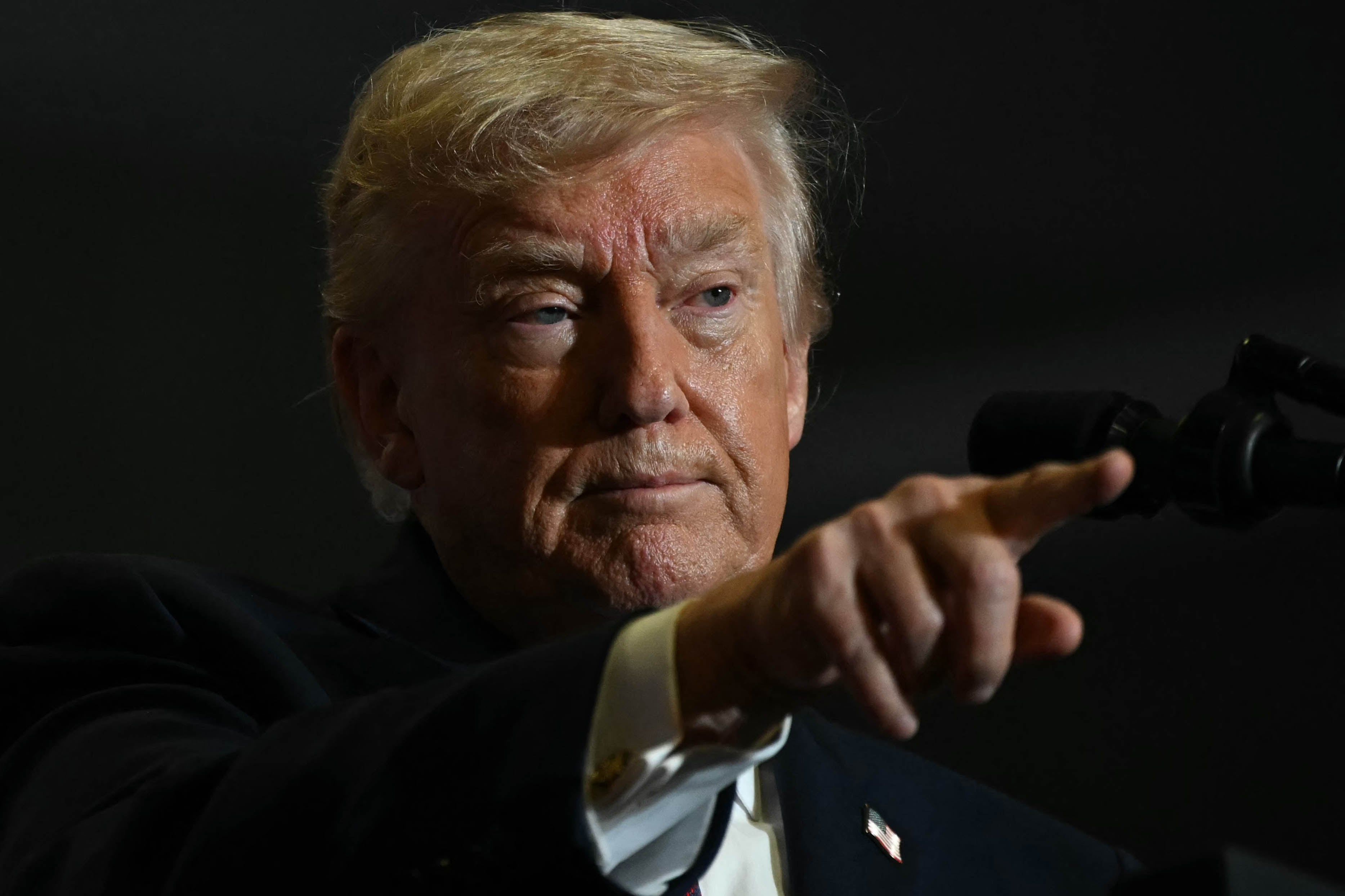 US President Donald Trump points as he speaks during a political rally in Rocky Mount, North Carolina on December 19, 2025. (Photo by ANDREW CABALLERO-REYNOLDS / AFP)
