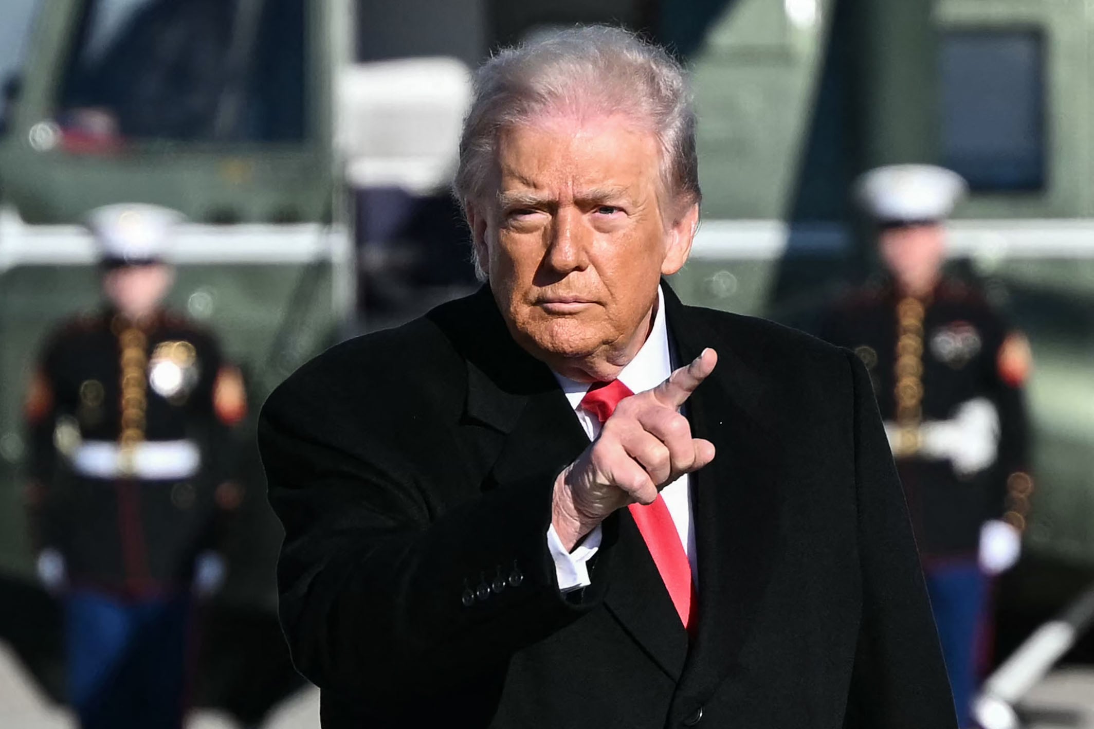 US President Donald Trump gestures as he walks to board Air Force One at Joint Base Andrews, Maryland on January 13, 2026, as he travels to Detroit, Michigan. (Photo by Mandel NGAN / AFP)