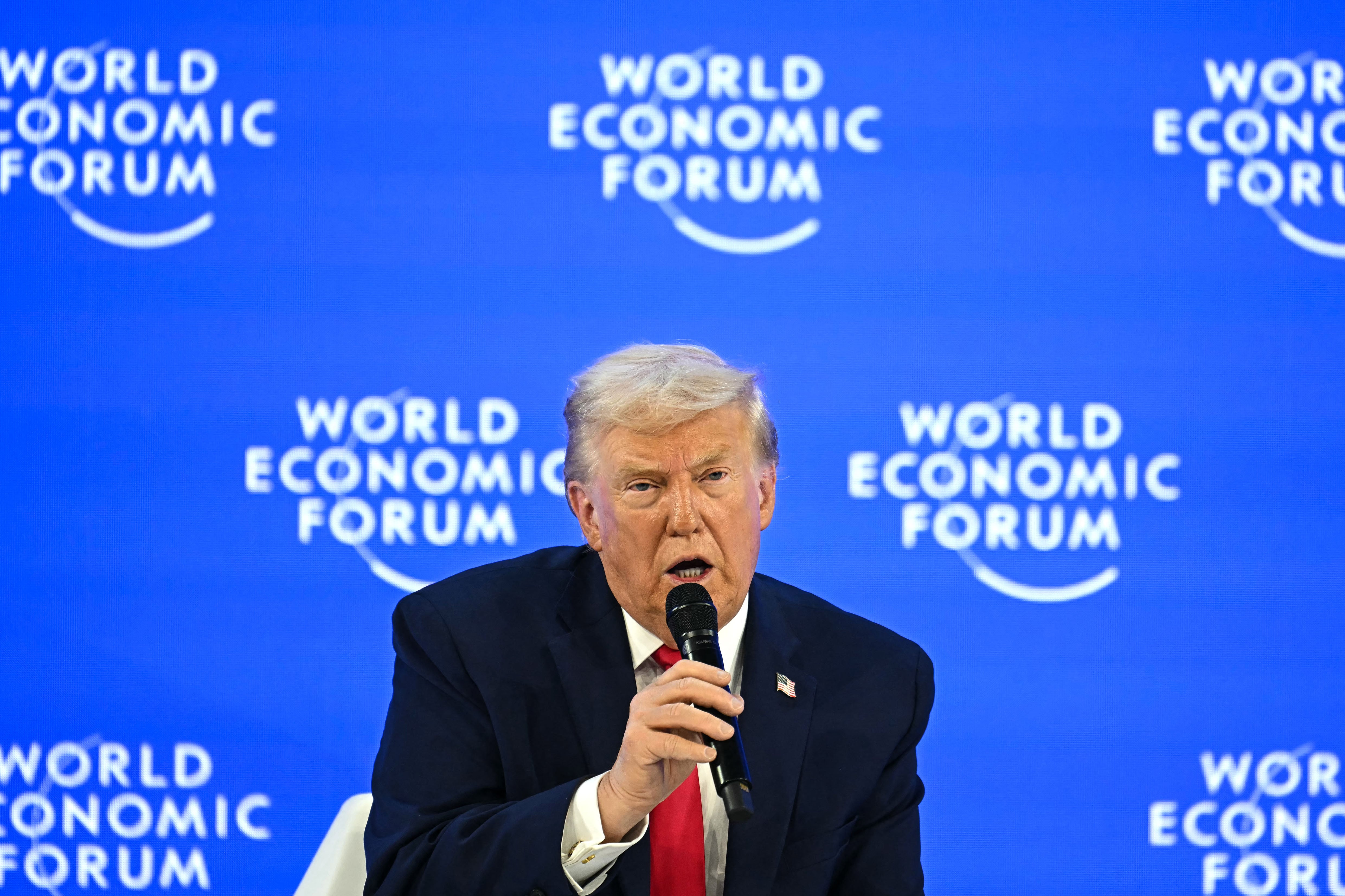 US President Donald Trump gestures during the World Economic Forum (WEF) annual meeting in Davos on January 21, 2026. The World Economic Forum takes place in Davos from January 19 to January 23, 2026. (Photo by Fabrice COFFRINI / AFP)