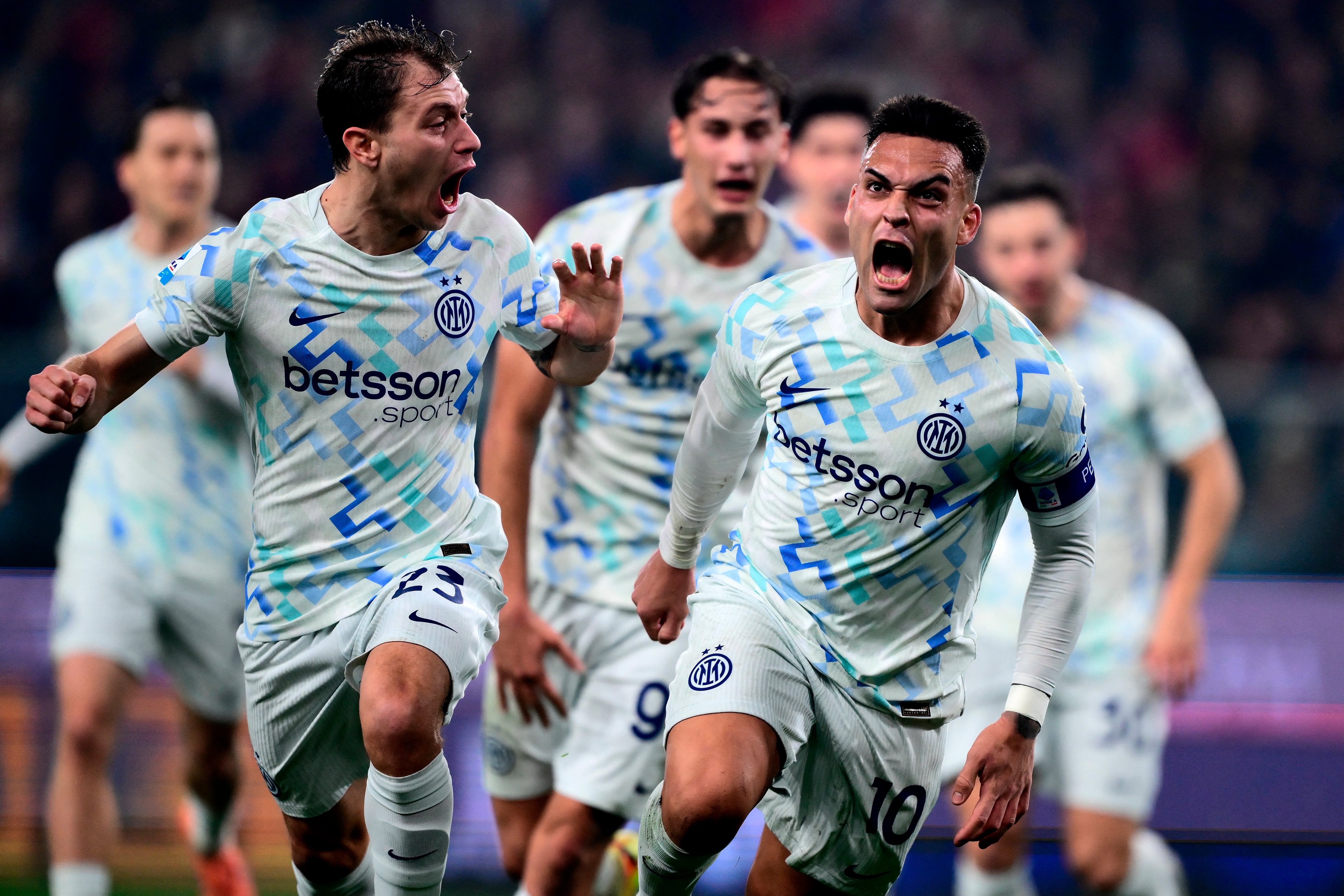 Inter Milan’s Argentine forward #10 Lautaro Martínez (R) celebrates after scoring a goal with Inter Milan’s Italian midfielder #23 Nicolo Barella (L) during the Italian Serie A football match between Genoa and Inter Milan at Luigi Ferraris Stadium in Genoa on December 14, 2025. (Photo by MARCO BERTORELLO / AFP)