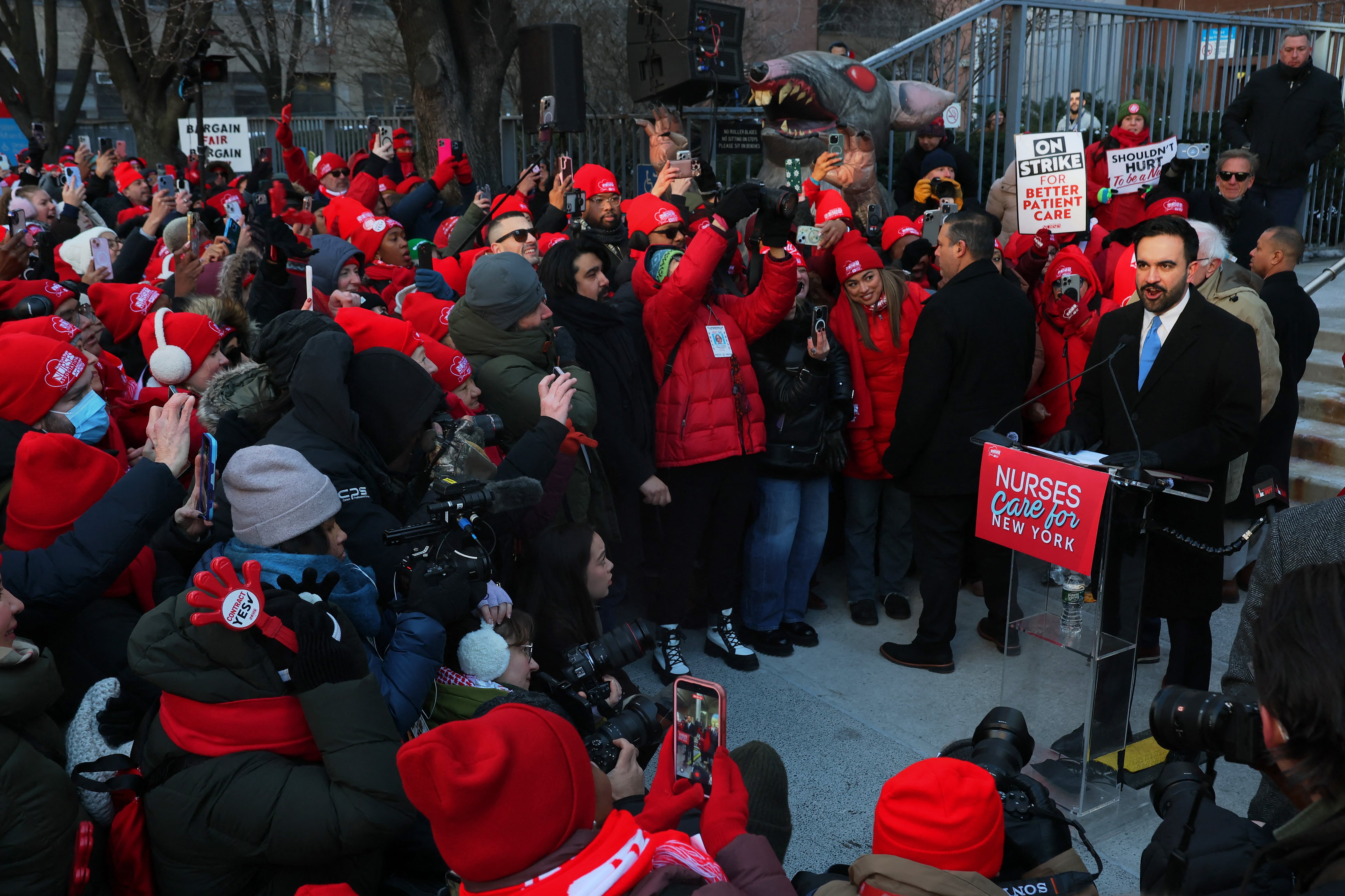 NEW YORK, NEW YORK - JANUARY 20: Mayor Zohran Mamdani speaks to nurses from Mount Sinai West striking outside the hospital on January 20, 2026 in New York City. Sen. Bernie Sanders (I-VT) and Mayor Zohran Mamdani joined striking nurses with the New York State Nurses Association on the picket line on the eighth day of their walkout. Nearly 15,000 nurses from NYC's biggest hospital have gone on strike demanding higher wages, more security at hospitals to reduce violent episodes and shootings, and a commitment to ensuring minimum staffing ratios. Michael M. Santiago/Getty Images/AFP (Photo by Michael M. Santiago / GETTY IMAGES NORTH AMERICA / Getty Images via AFP)