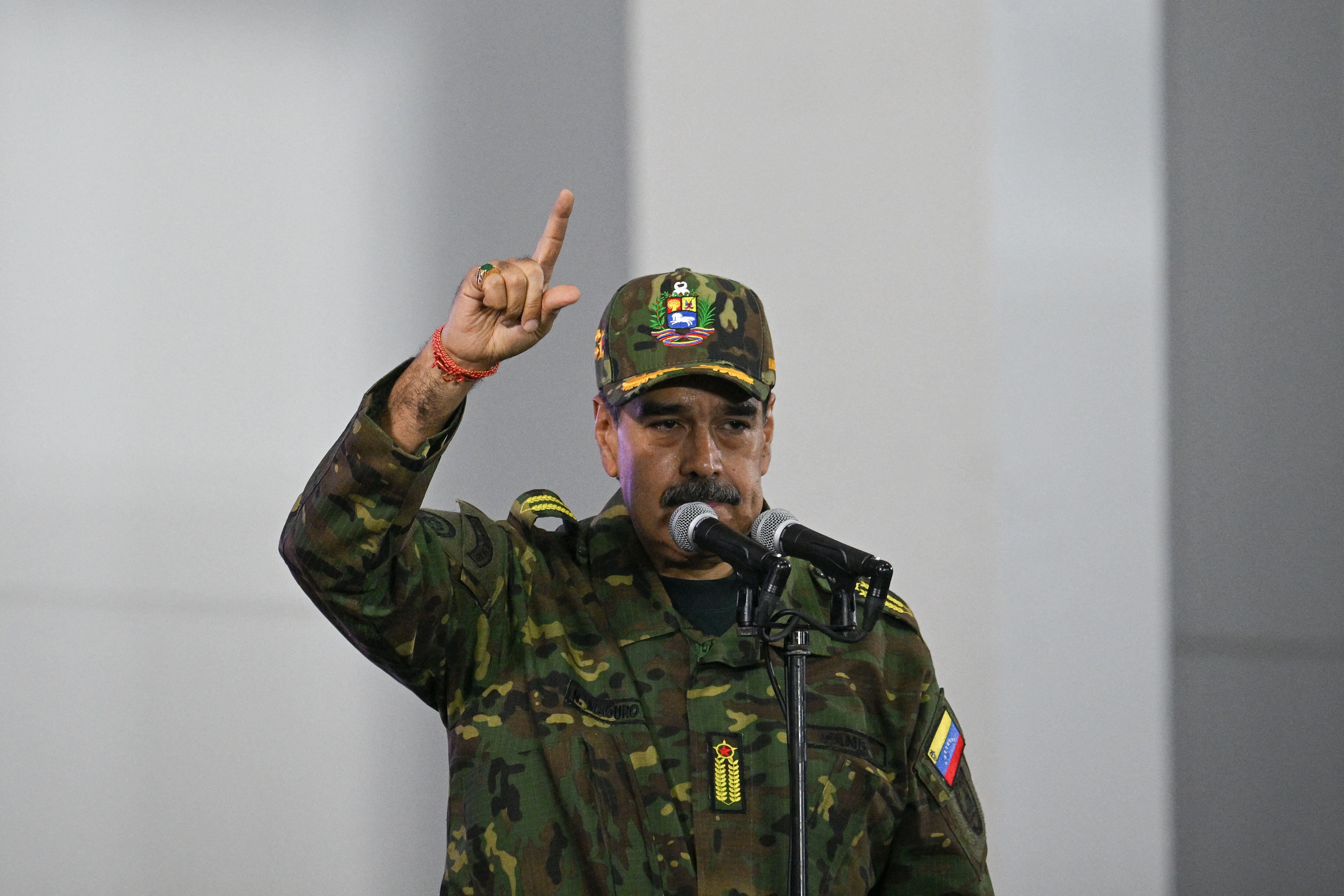 Venezuela's President Nicolas Maduro delivers a speech during a military ceremony in Fuerte Tiuna, Caracas on November 25, 2025. (Photo by Federico PARRA / AFP)