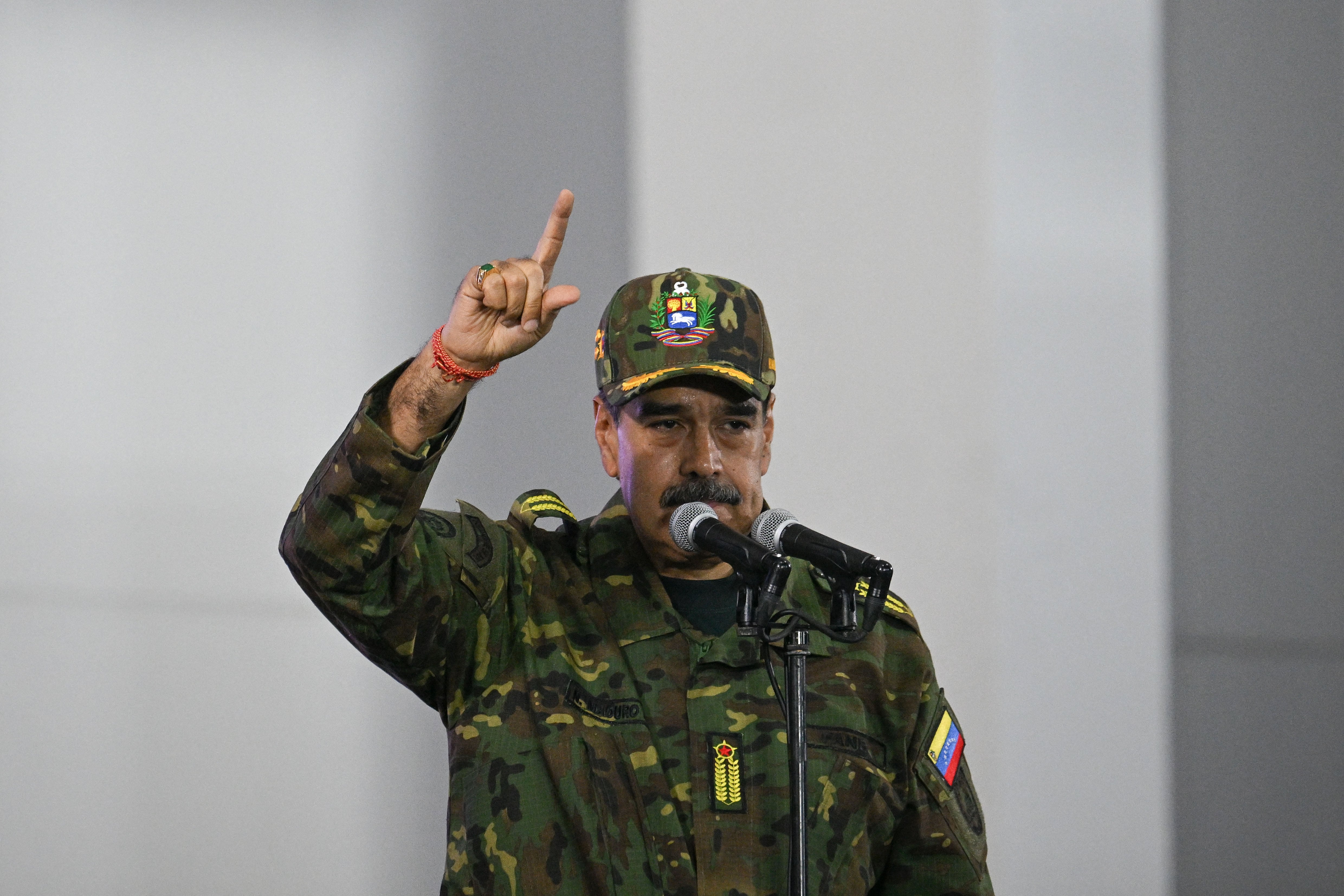 Venezuela's President Nicolas Maduro delivers a speech during a military ceremony in Fuerte Tiuna, Caracas on November 25, 2025. (Photo by Federico PARRA / AFP)