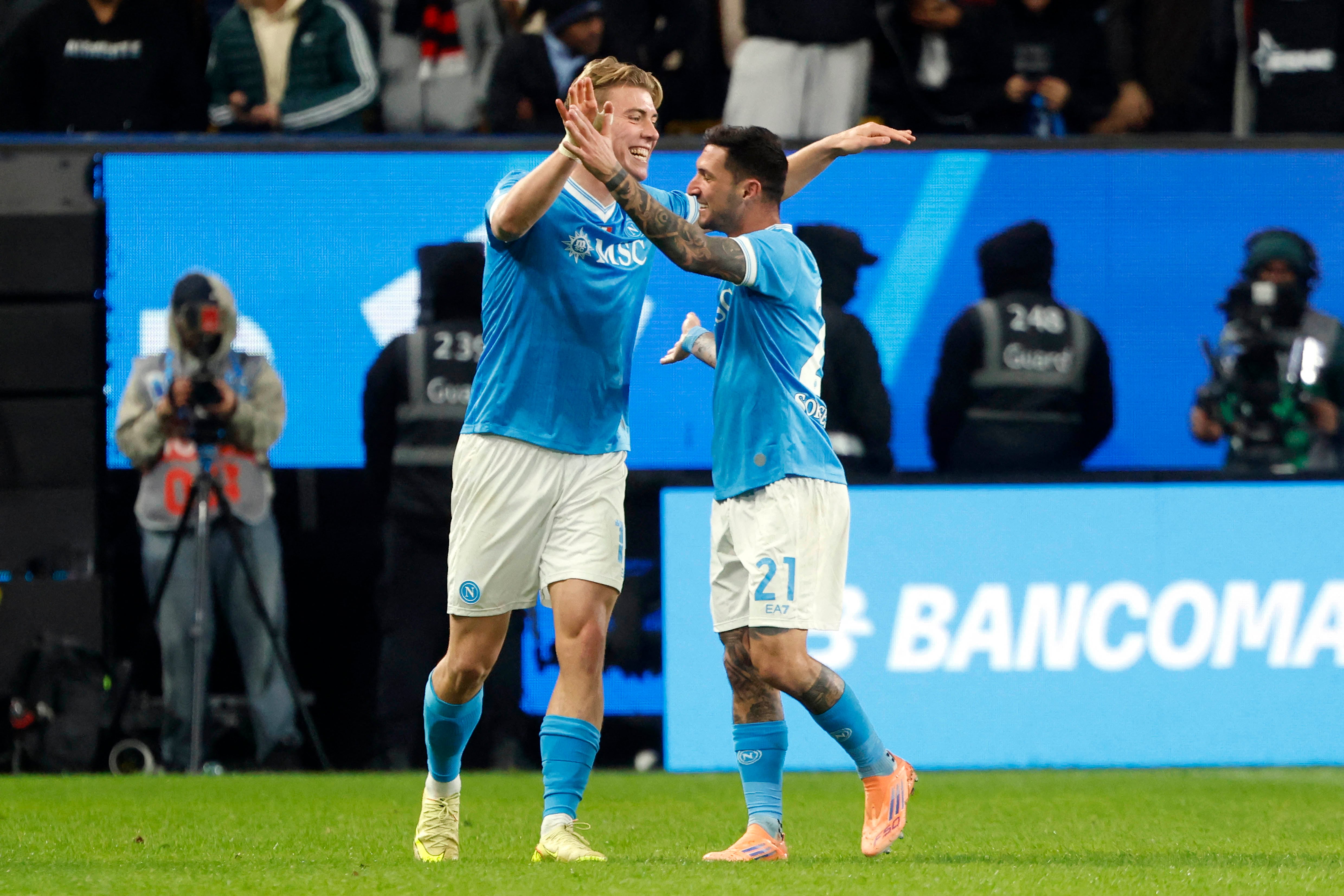 SCC Napoli Rasmus Hojlund (L) celebrates with teammate Matteo Politano
after scoring the second goal during the Italian Super Cup semi-final match between SCC Napoli and AC Milan at King Saud University Stadium in Riyadh on December 18, 2025. (Photo by Fayez Nureldine / AFP)