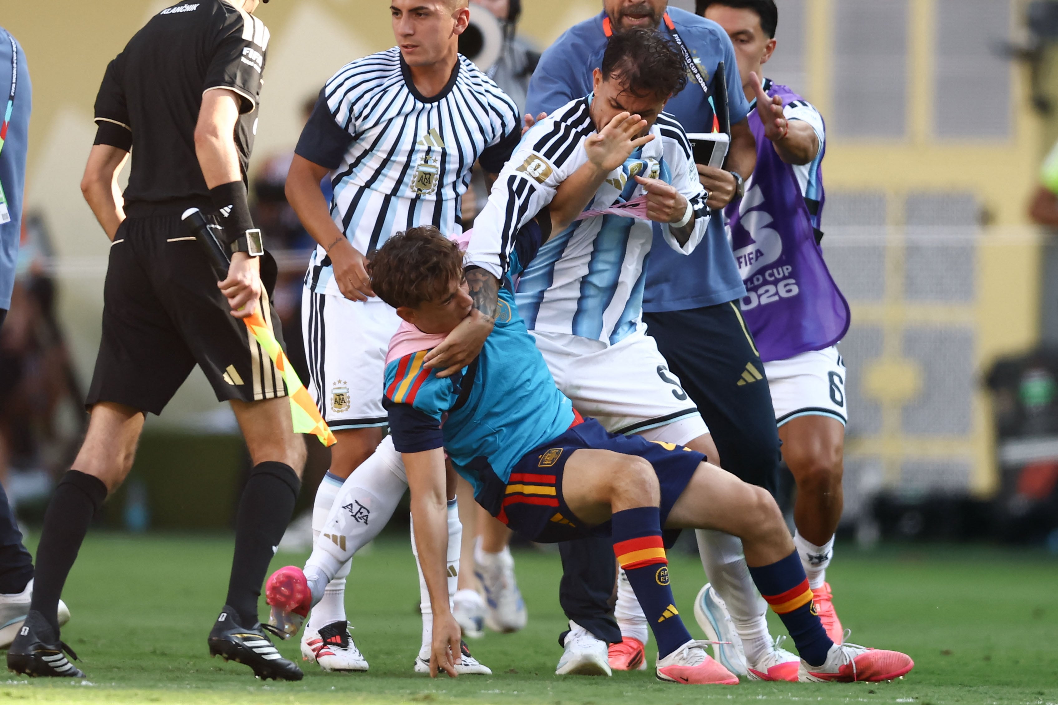 Argentina's midfielder #05 Leandro Paredes (top) clashes with Spain's midfielder #09 Gavi during the 2026 World Cup football tournament final match between Spain and Argentina at the New York/New Jersey Stadium in East Rutherford on July 19, 2026. (Photo by CHARLY TRIBALLEAU / AFP)