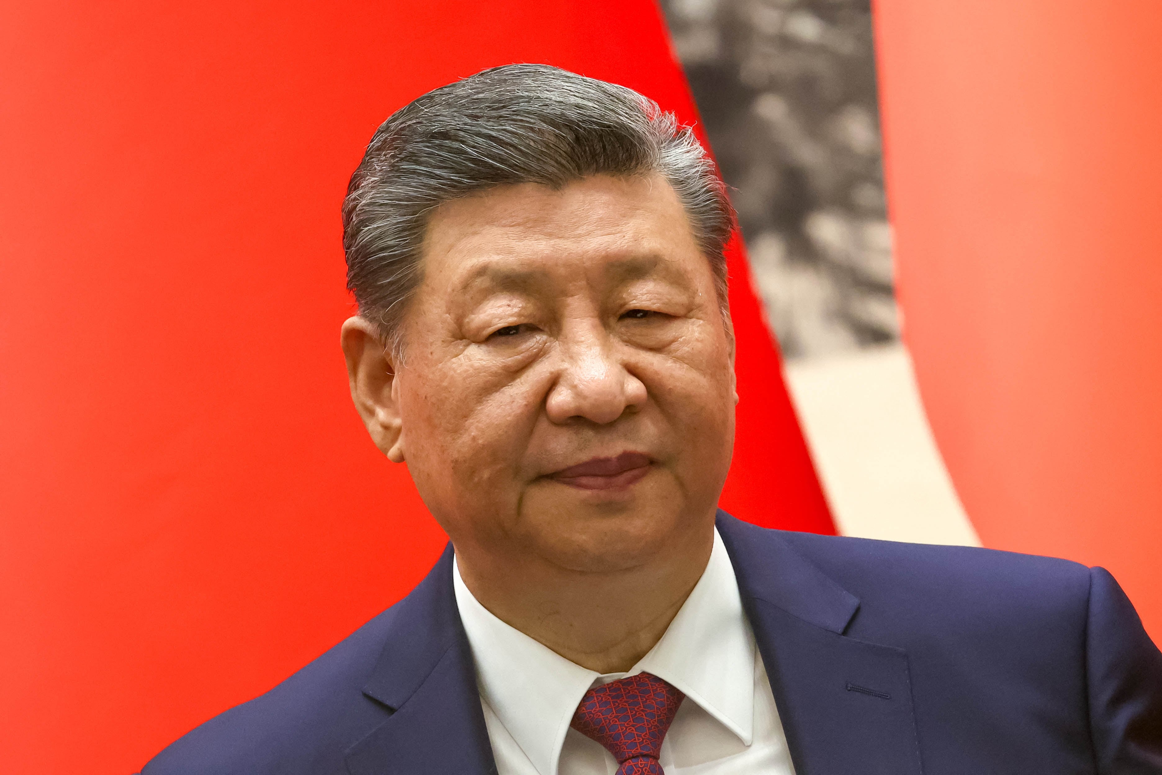 In this pool photograph distributed by the Russian state agency Sputnik, China's President Xi Jinping attends a signing ceremony with Russia's President following their talks in Beijing on May 20, 2026. (Photo by Alexander KAZAKOV / POOL / AFP)