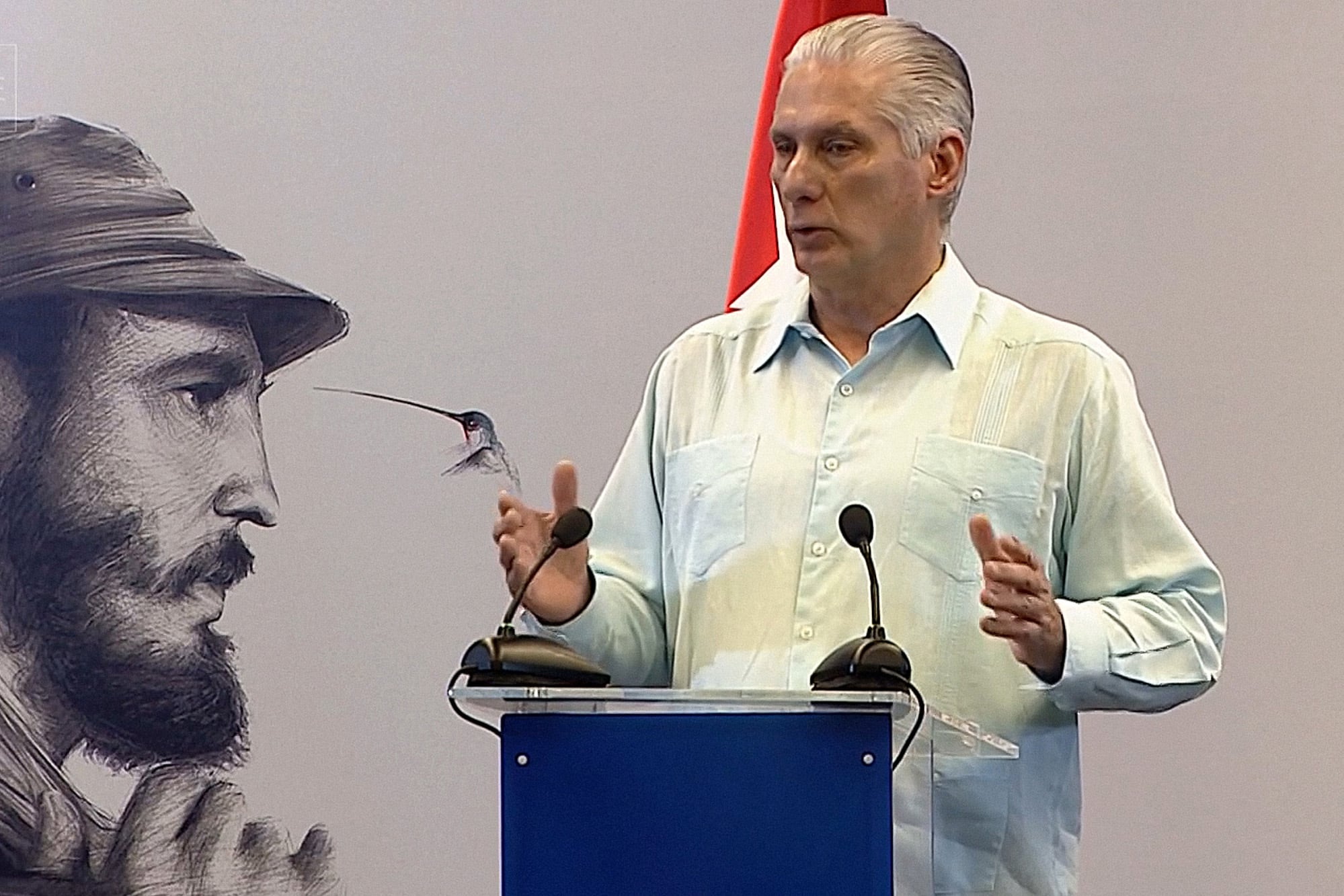 Screen grab from footage broadcast by Cuban official TV on March 13, 2026, showing Cuba's President Miguel Diaz-Canel speaking next to an image of late Cuban leader Fidel Castro during a meeting with the communist-governed island's top authorities in Havana. President Miguel Diaz-Canel said on March 13 that Cuban and US officials recently held talks as President Donald Trump's administration piles pressure on the communist island. (Photo by CUBA TV / AFP) / RESTRICTED TO EDITORIAL USE - MANDATORY CREDIT "AFP PHOTO / CUBA TV " - NO MARKETING NO ADVERTISING CAMPAIGNS - DISTRIBUTED AS A SERVICE TO CLIENTS