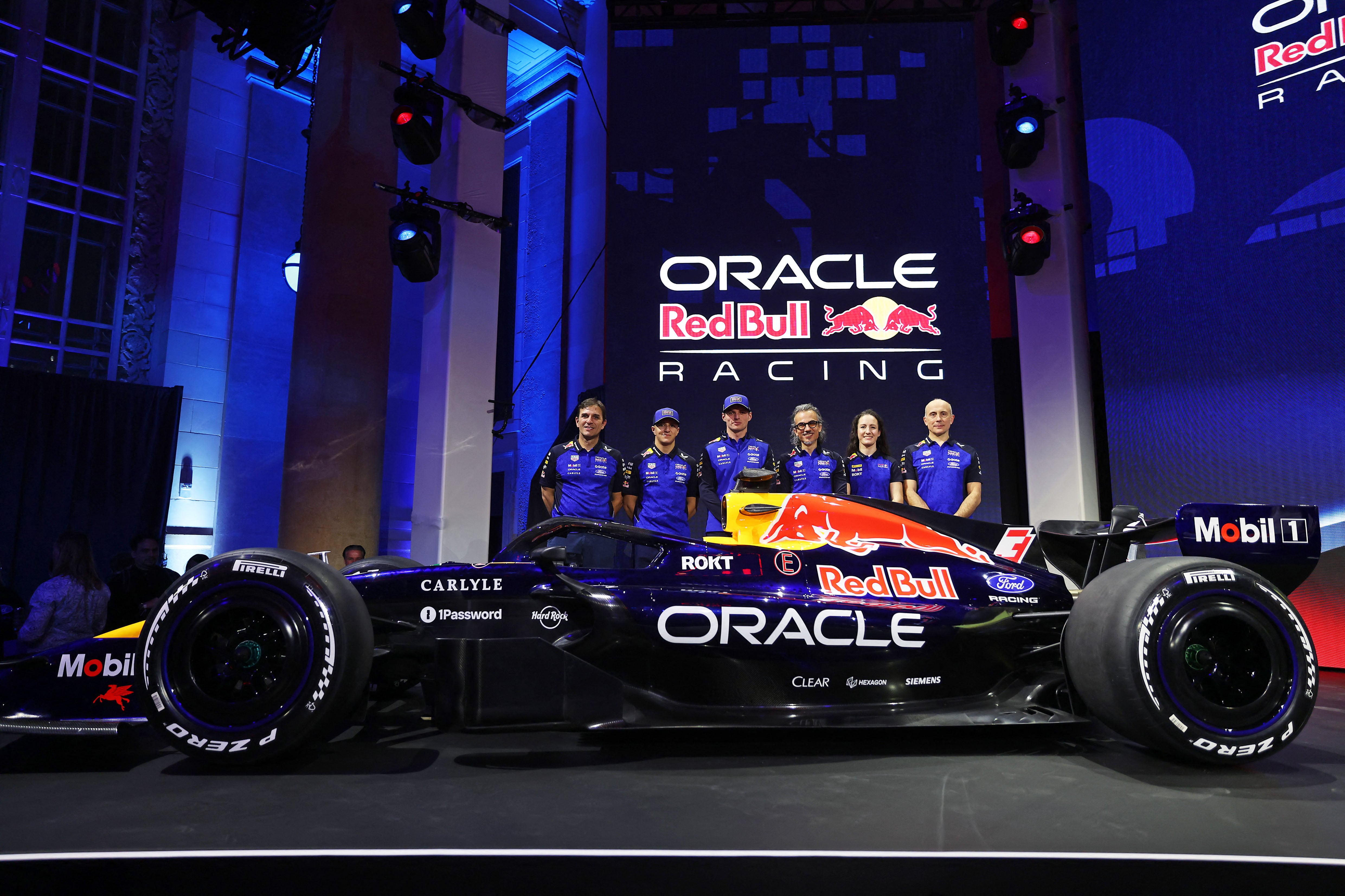 DETROIT, MICHIGAN - JANUARY 15: Pierre Wache, Technical Director of Oracle Red Bull Racing, Isack Hadjar of France and Oracle Red Bull Racing, Max Verstappen of the Netherlands and Oracle Red Bull Racing, Laurent Mekies, Team Principal of Oracle Red Bull Racing, Alisha Palmowski, F1 Academy driver for Oracle Red Bull Racing and Phillip Prew, Technical Operations Director unveil their livery on stage during the Red Bull Racing season launch at Michigan Central Station on January 15, 2026 in Detroit, Michigan. Mark Thompson/Getty Images/AFP (Photo by Mark Thompson / GETTY IMAGES NORTH AMERICA / Getty Images via AFP)