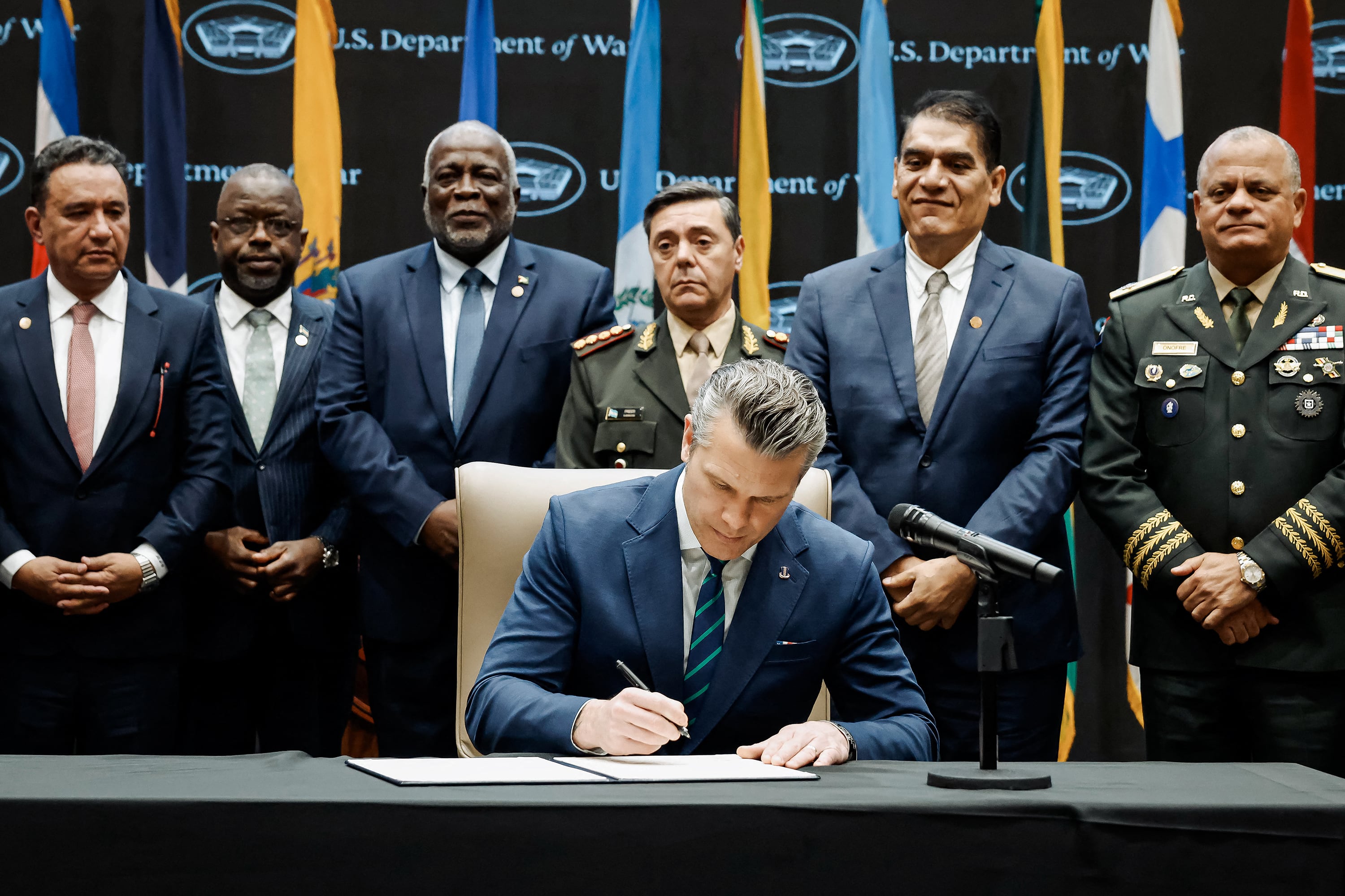 US Secretary of Defense Pete Hegseth signs the Americas Counter Cartel Conference Joint Security Declaration during the inaugural Americas Counter Cartel Conference at the US Southern Command