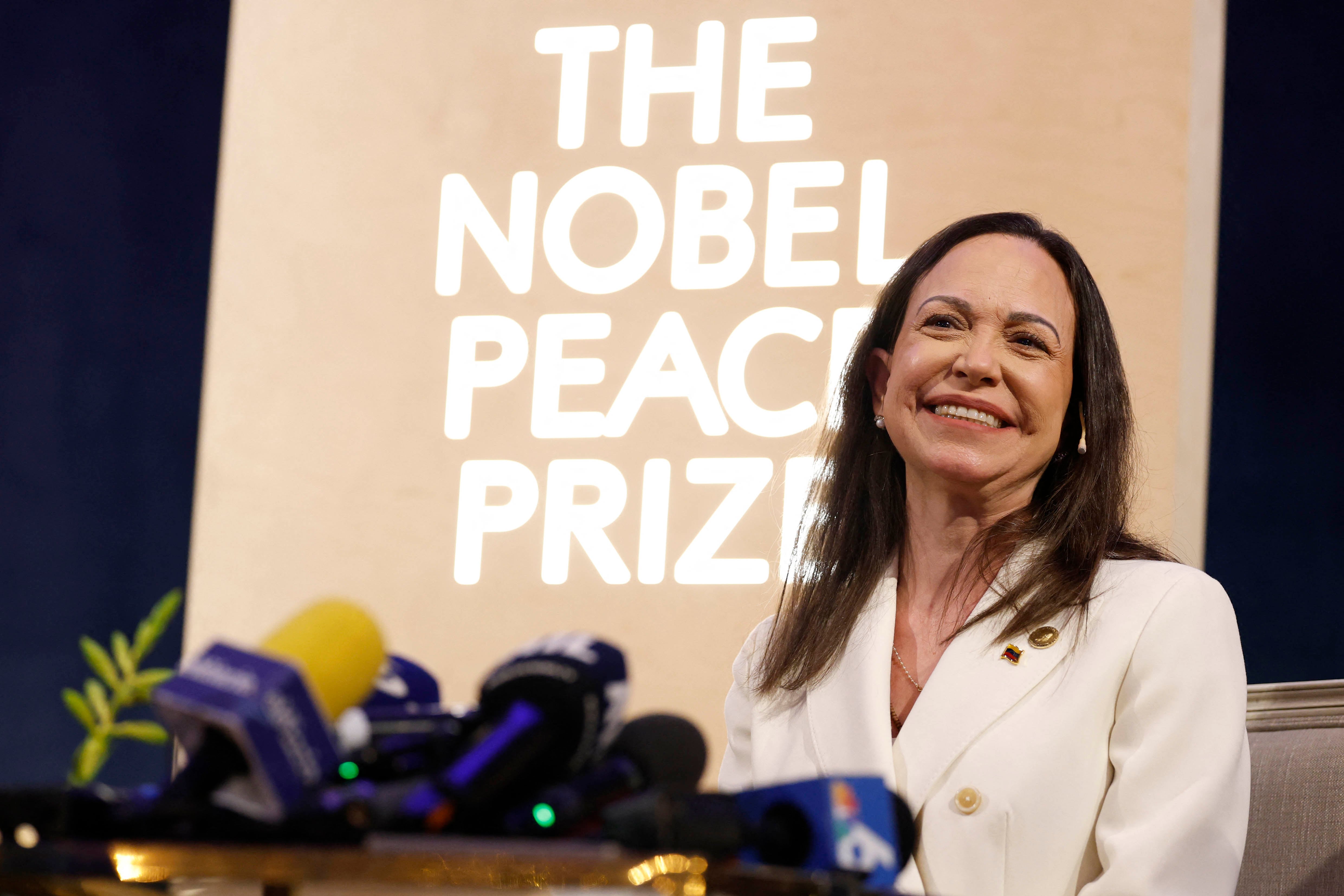 Nobel peace prize laureate Maria Corina Machado addresses a press conference at the Grand Hotel in Oslo, Norway, on December 11, 2025. The 58-year-old, who has been in hiding in her home country since June 2024, missed the award of the Nobel Prize in Oslo on December 10. But she waved to supporters from her hotel shortly after arriving during the night. Maria Corina Machado is the lynchpin of opposition to Venezuelan President Nicolas Maduro's regime, a fearless activist with rock star appeal whose inability to attend her own Nobel prize ceremony underlined the dangers she faces. (Photo by Odd ANDERSEN / AFP)