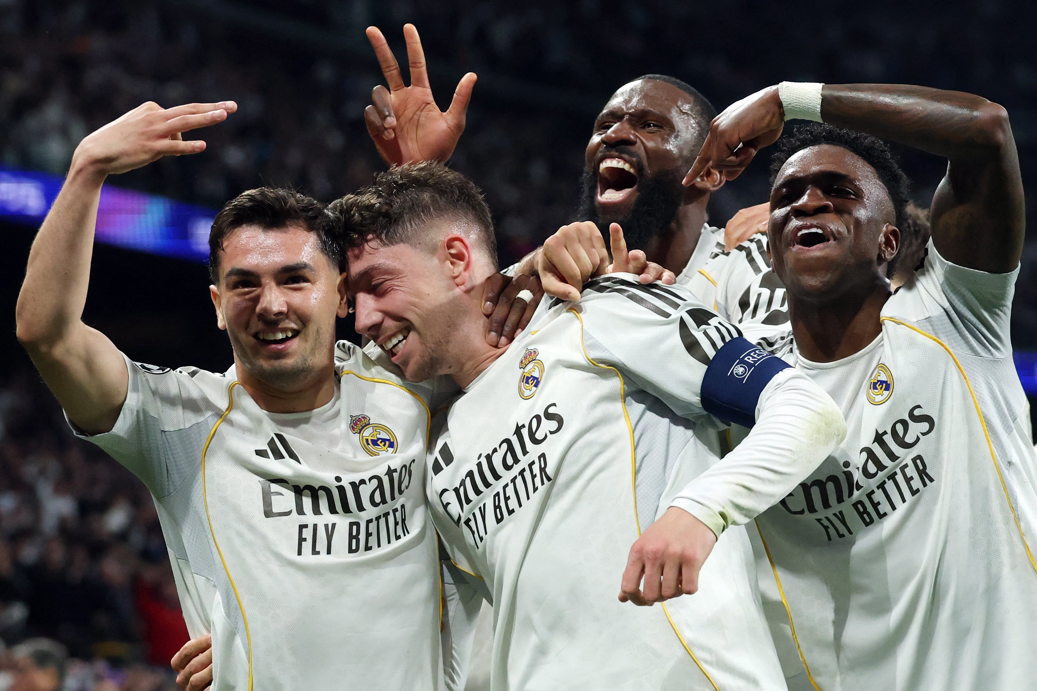 Real Madrid's Uruguayan midfielder #08 Federico Valverde (2L) celebrates his third goal during the UEFA Champions League last 16 first leg football match between Real Madrid CF and Manchester City at Santiago Bernabeu Stadium in Madrid on March 11, 2026. (Photo by Pierre-Philippe MARCOU / AFP)