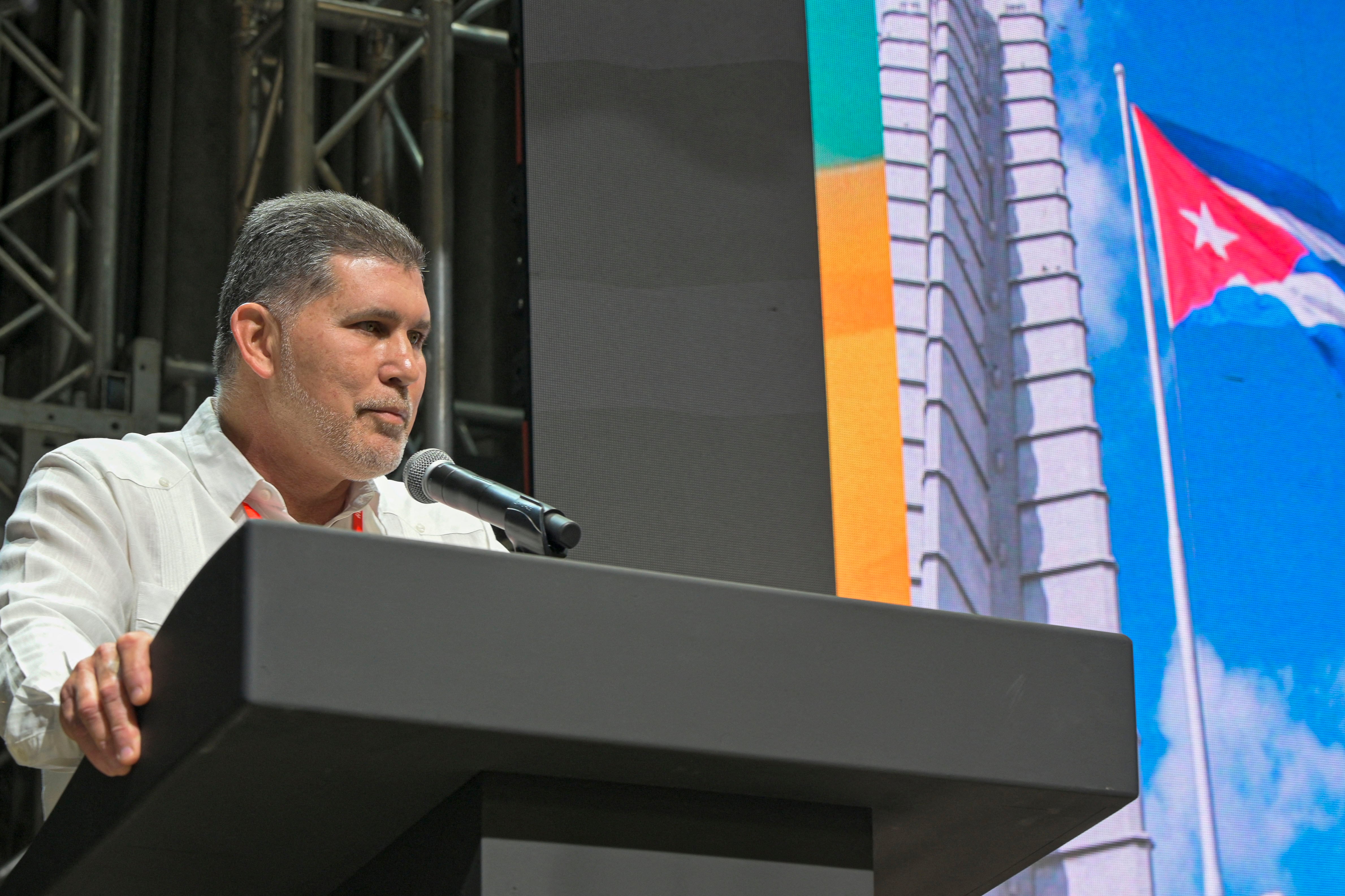 Cuba's Minister of Foreign Trade and Foreign Investment, Oscar Perez-Oliva Fraga delivers a speech during the 41 Havana International Fair, on November 25, 2025. The Havana Fair is the main commercial hub in Cuba and a key space to promote foreign investment, diversify partnerships, and stimulate national production. (Photo by ADALBERTO ROQUE / AFP)