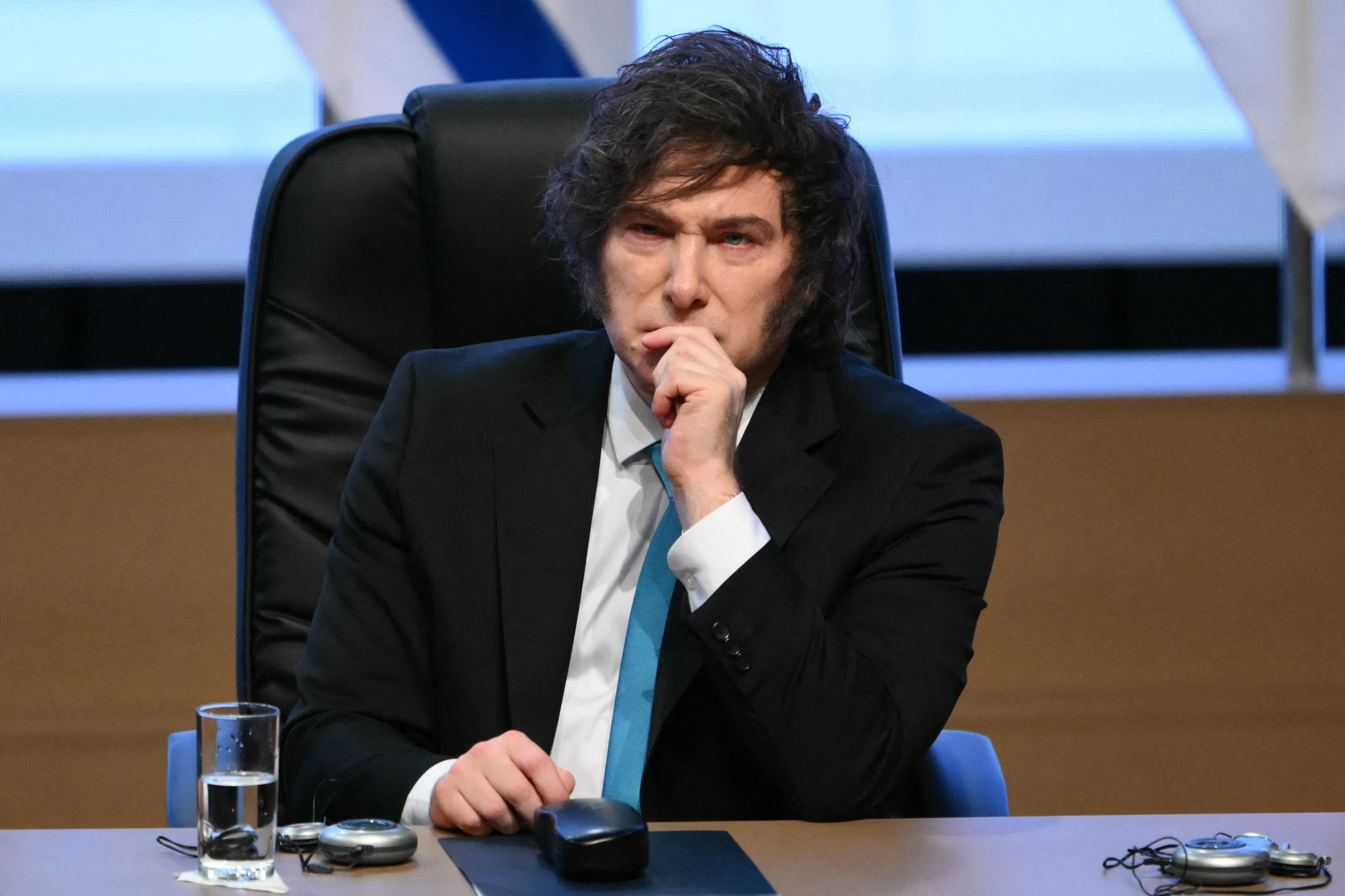 Argentina's President Javier Milei gestures during the signing ceremony of the trade agreement between the European Union and Mercosur, at the Gran Teatro Jose Asuncion Flores of Paraguay's Central Bank in Asuncion on January 17, 2026. The South American bloc Mercosur and the European Union on January 17 signed a major trade deal that has been 25 years in the making. (Photo by Luis ROBAYO / AFP)