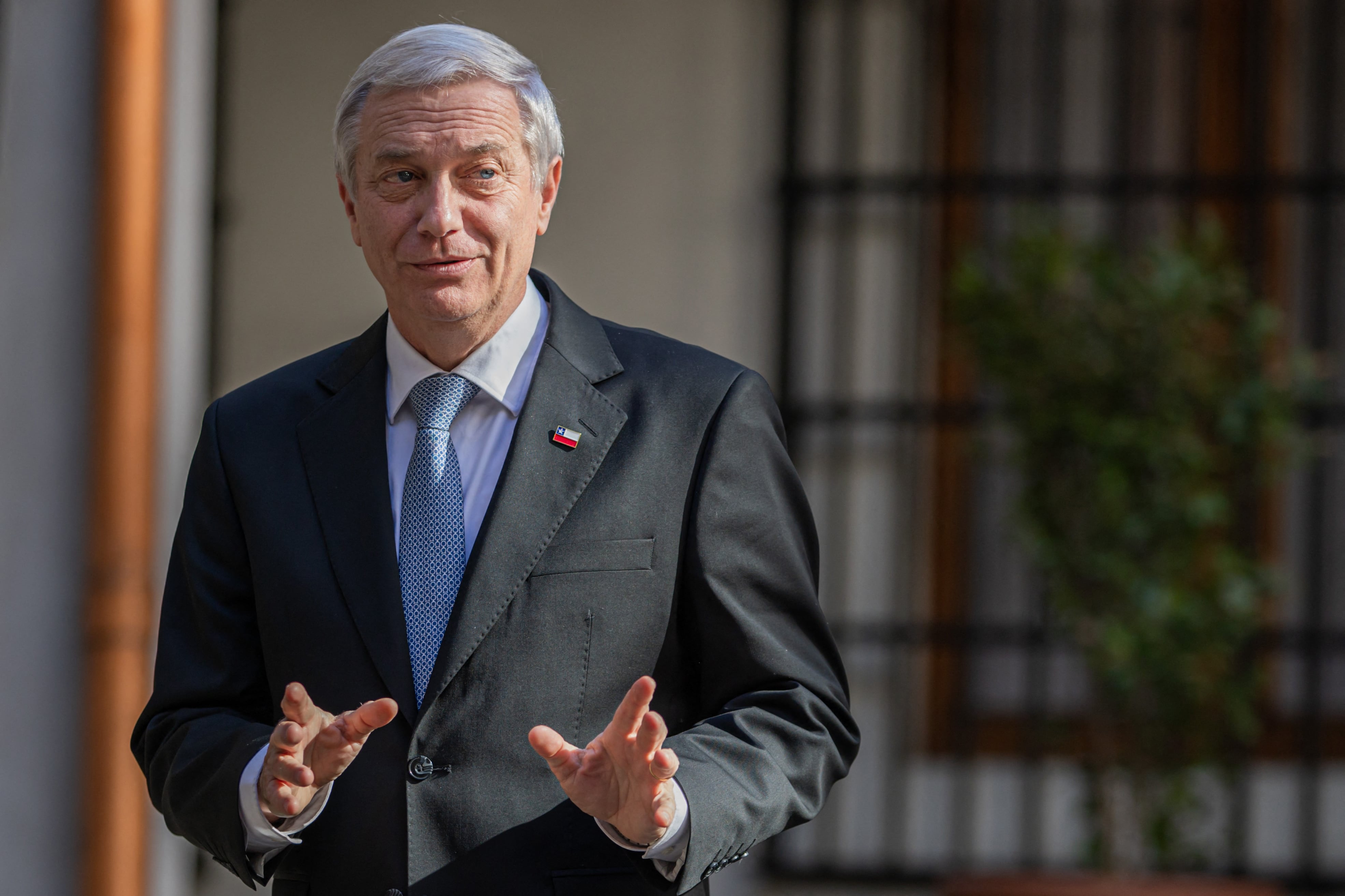 Chile's President-elect Jose Antonio Kast gestures as he leaves a press conference after a meeting with President Gabriel Boric at La Moneda Presidential Palace in Santiago on January 15, 2026. (Photo by Javier TORRES / AFP)