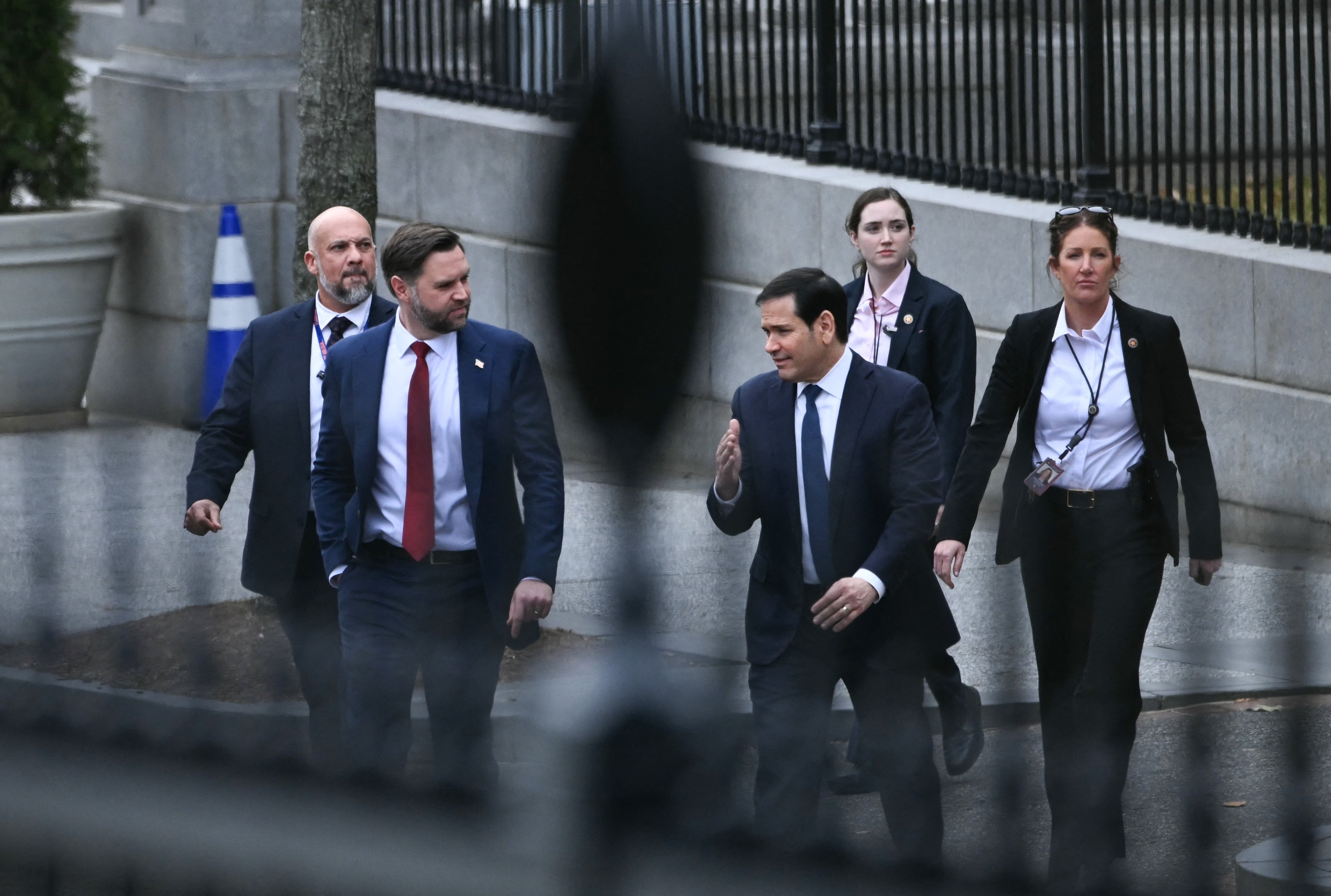 (L/R) US Vice President JD Vance and Secretary of State Marco Rubio depart the Eisenhower Executive Office Building on the White House campus after a meeting with Danish Foreign Minister Lars Lokke Rasmussen and Greenland's Foreign Minister Vivian Motzfeldt in Washington, DC, on January 14, 2026. US President Donald Trump insisted Wednesday the US needs to take control of Greenland, with NATO's support, just hours before talks about the Arctic island with top Danish, Greenlandic and US officials. Hours before the meeting with US Vice President JD Vance was due to start, Trump said that US control of Greenland -- an autonomous territory belonging to NATO ally Denmark -- was "vital" for his planned Golden Dome air and missile defense system. (Photo by Brendan SMIALOWSKI / AFP)