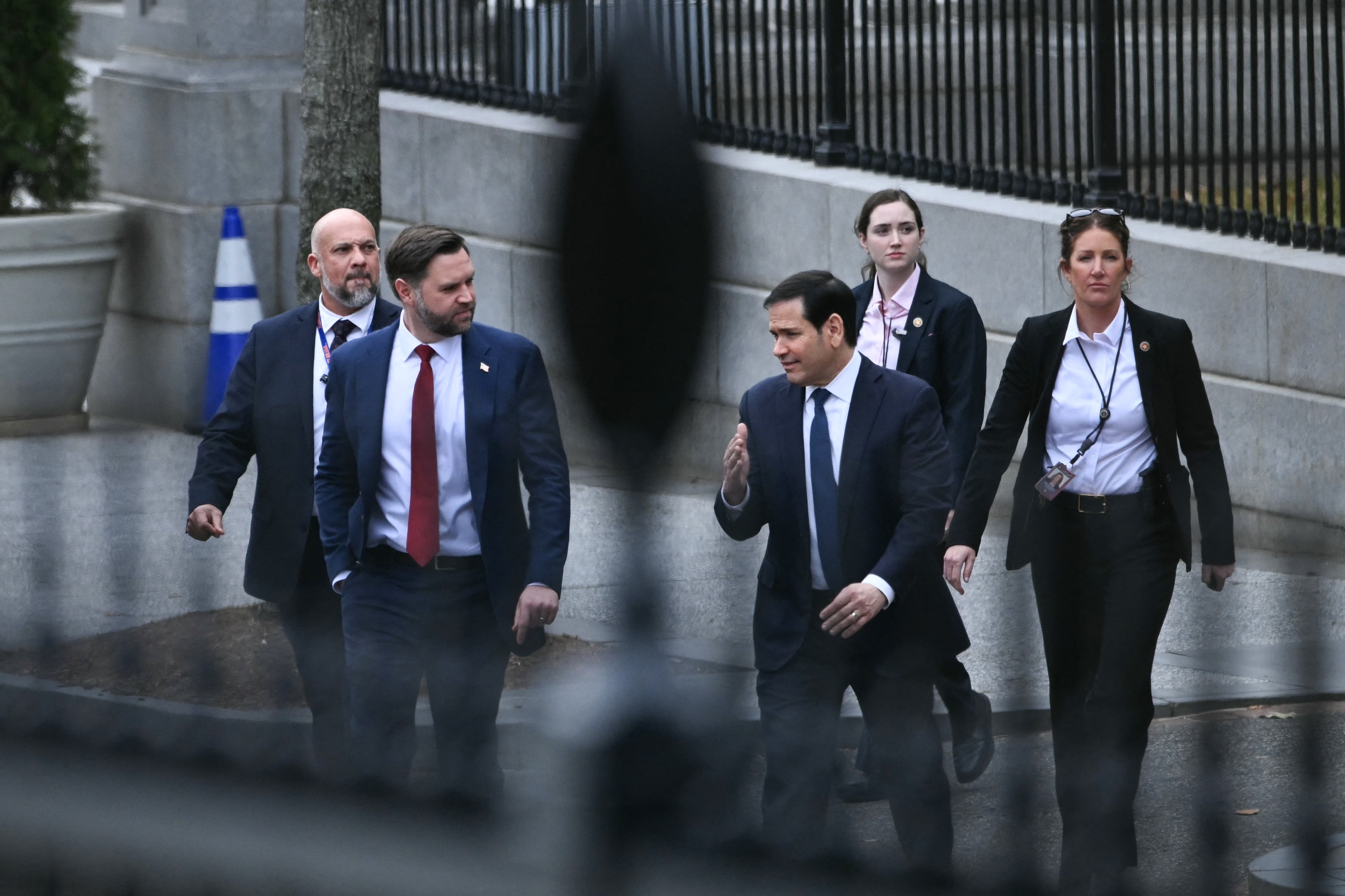 (L/R) US Vice President JD Vance and Secretary of State Marco Rubio depart the Eisenhower Executive Office Building on the White House campus after a meeting with Danish Foreign Minister Lars Lokke Rasmussen and Greenland's Foreign Minister Vivian Motzfeldt in Washington, DC, on January 14, 2026. US President Donald Trump insisted Wednesday the US needs to take control of Greenland, with NATO's support, just hours before talks about the Arctic island with top Danish, Greenlandic and US officials. Hours before the meeting with US Vice President JD Vance was due to start, Trump said that US control of Greenland -- an autonomous territory belonging to NATO ally Denmark -- was "vital" for his planned Golden Dome air and missile defense system. (Photo by Brendan SMIALOWSKI / AFP)