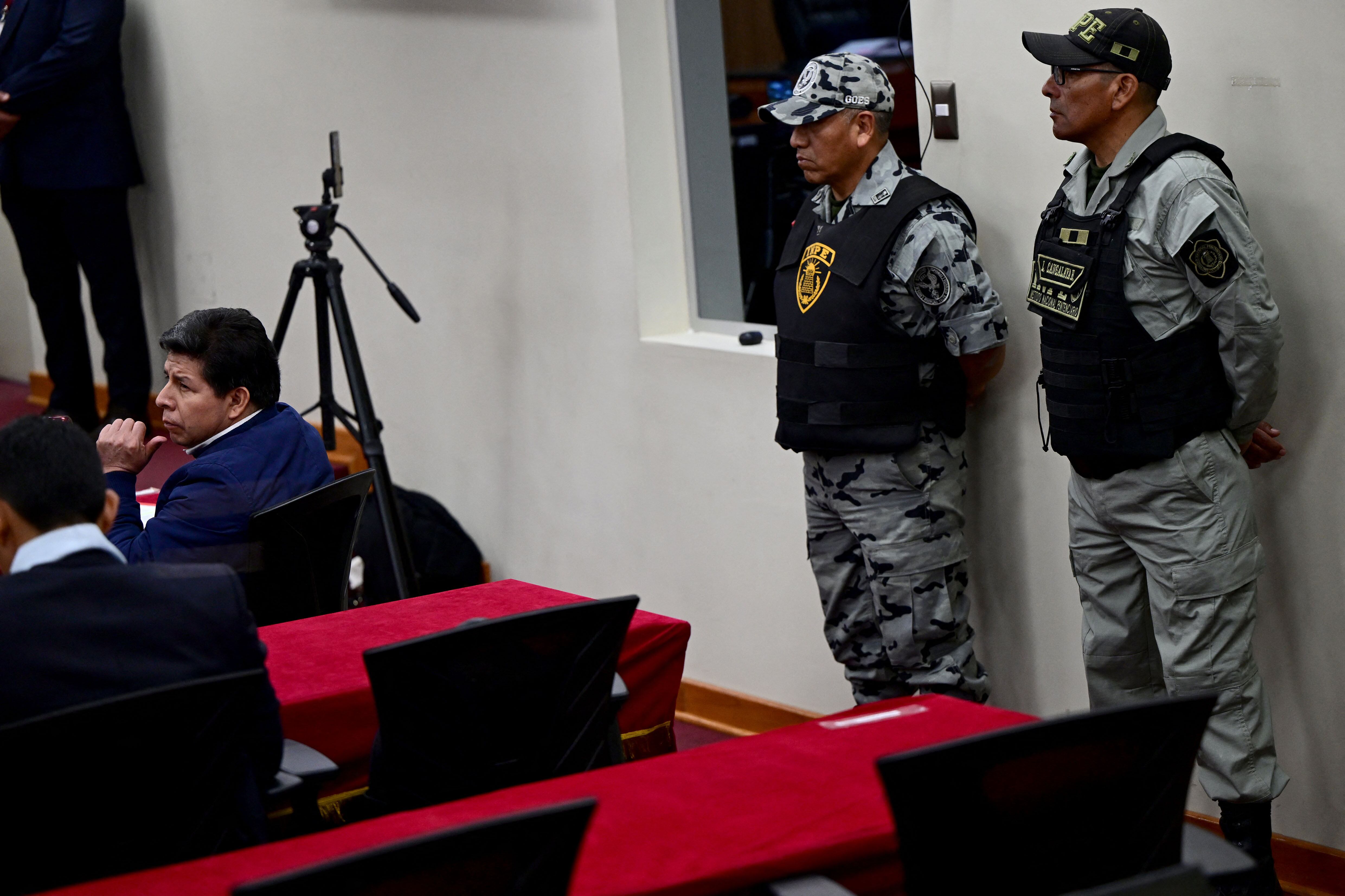 Peru's former president (2021–2022) Pedro Castillo sits in the courtroom of the National Police Special Operations Directorate (DINOES) as the verdict is issued in his trial in Lima on November 27, 2025. A Peruvian court will issue its verdict on Thursday in the trial of former left-wing president Pedro Castillo, who was impeached and jailed all in the same day in 2022 following a power grab attempt. (Photo by ERNESTO BENAVIDES / AFP)