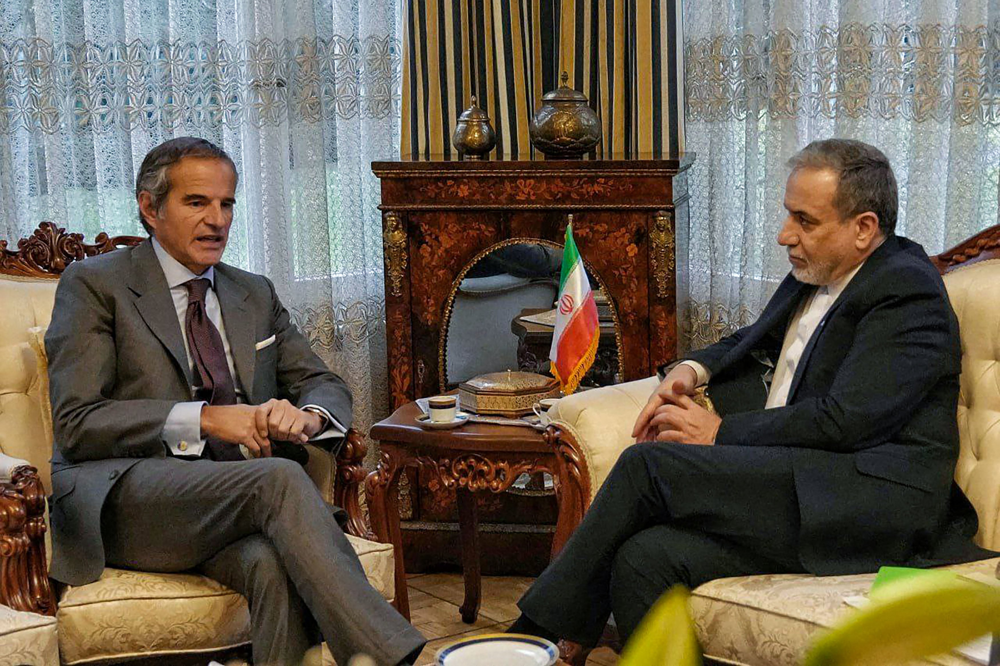 In this handout photo released by the Iranian Ministry of Foreign Affairs, Iran's Foreign Minister Abbas Araghchi (R) holds a meeting with International Atomic Energy Agency head Rafael Grossi in Geneva on February 16, 2026. Iran's foreign minister has arrived in Geneva ahead of a second round of negotiations with the US, Iranian state television said February 16, as Washington keeps up pressure on the Islamic republic. (Photo by Iranian Ministry of Foreign Affairs / AFP) / XGTY / RESTRICTED TO EDITORIAL USE - MANDATORY CREDIT "AFP PHOTO / IRANIAN MINISTRY OF FOREIGN AFFAIRS" - NO MARKETING NO ADVERTISING CAMPAIGNS - DISTRIBUTED AS A SERVICE TO CLIENTS