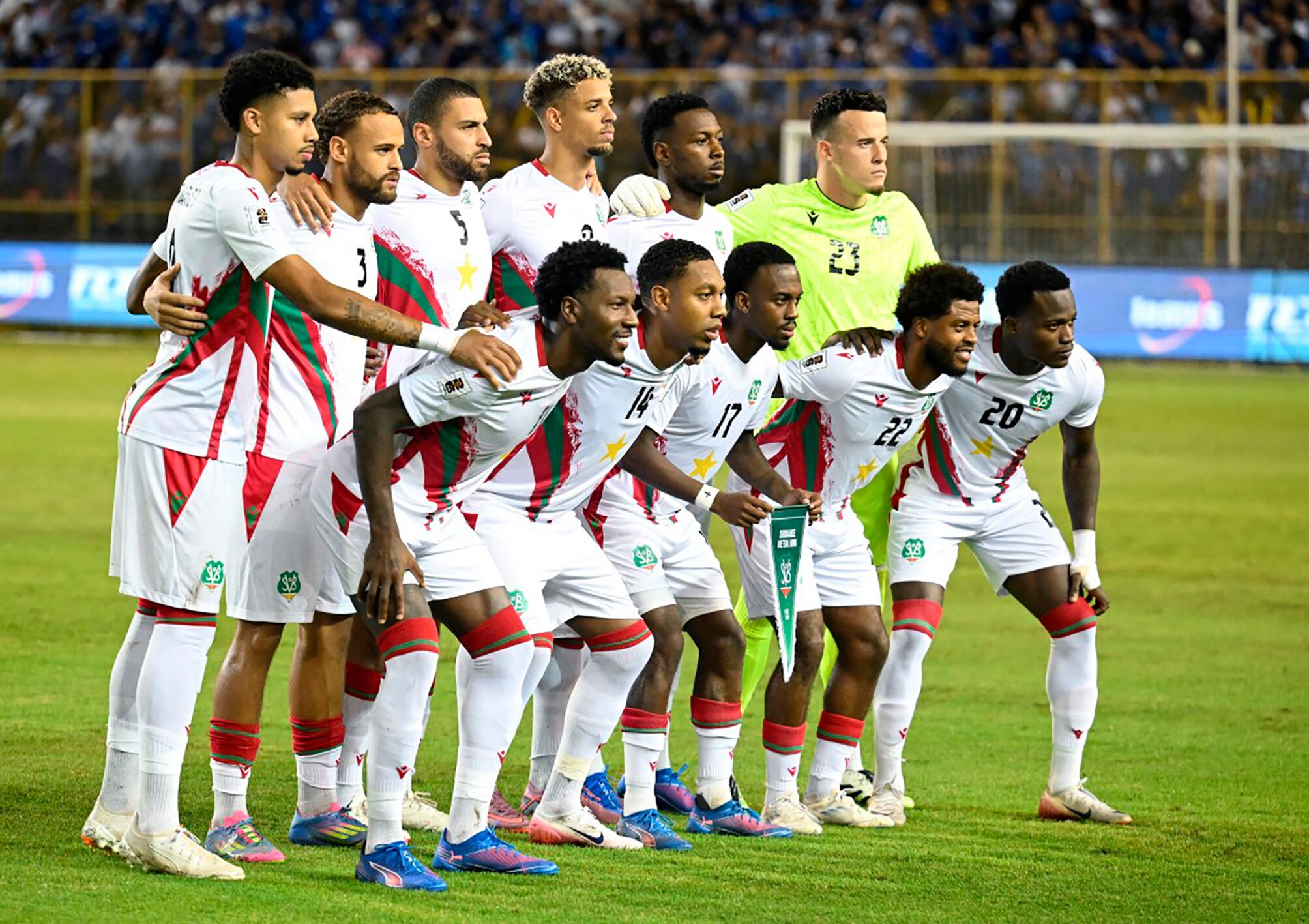 Suriname players pose for pictures before the 2026 FIFA World Cup Concacaf qualifier football match between El Salvador and Suriname at the Cuscatlan Stadium in San Salvador on September 8, 2025. (Photo by Marvin RECINOS / AFP)