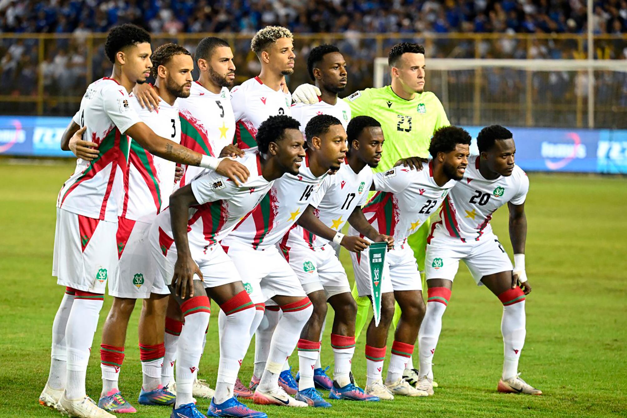 Suriname players pose for pictures before the 2026 FIFA World Cup Concacaf qualifier football match between El Salvador and Suriname at the Cuscatlan Stadium in San Salvador on September 8, 2025. (Photo by Marvin RECINOS / AFP)