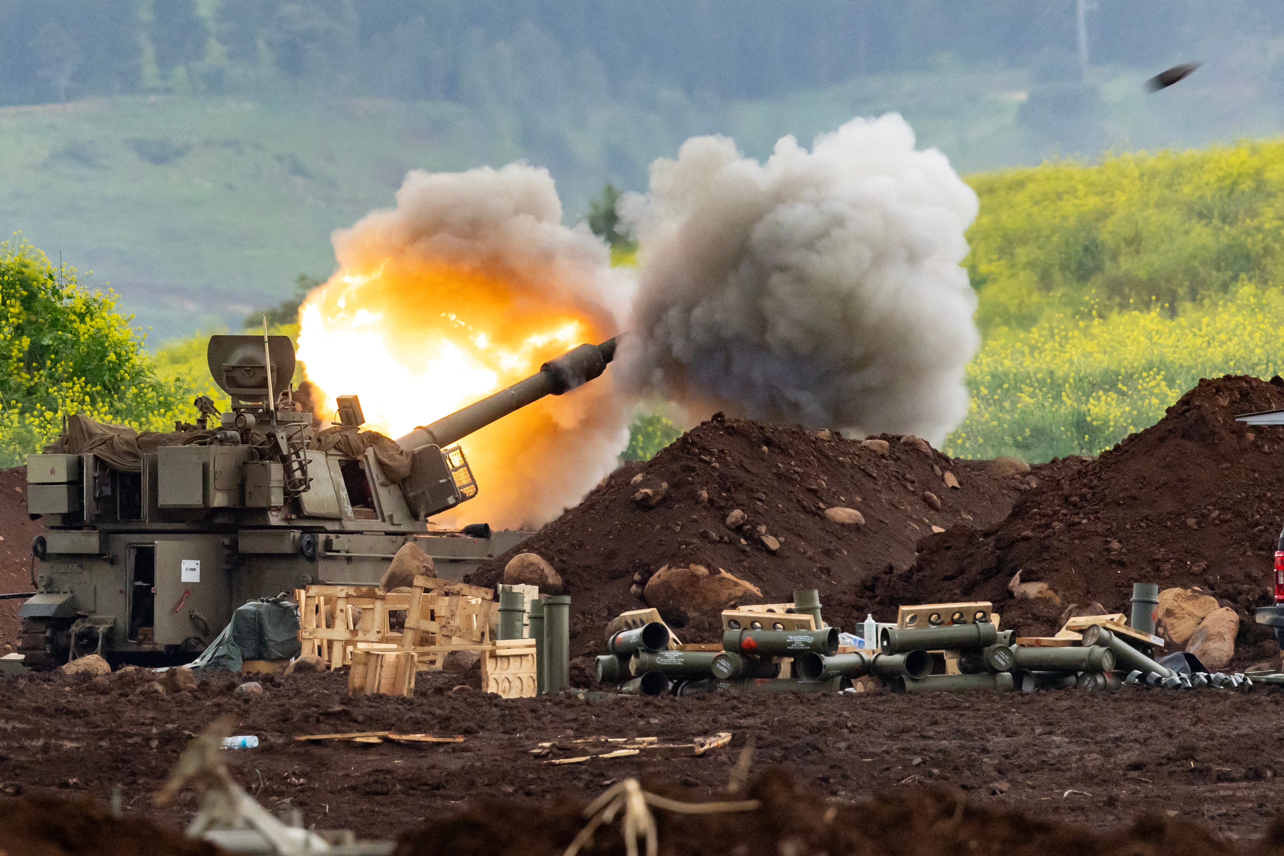 An Israeli self-propelled howitzer artillery gun fires rounds towards southern Lebanon from a position in the upper Galilee in northern Israel near the border on March 15, 2026. Israel said on March 15, 2026, that no direct talks were planned with Lebanon to end the war, a day after a Lebanese official said Beirut was preparing a delegation to negotiate with Israel. (Photo by Odd ANDERSEN / AFP) /